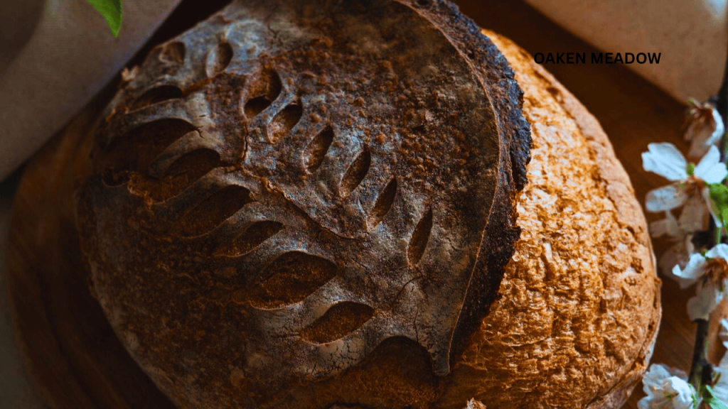 Close-up of fresh sourdough bread and a bubbling starter jar, highlighting one of the 7 traditional kitchen skills every modern homesteader should master for gut health.